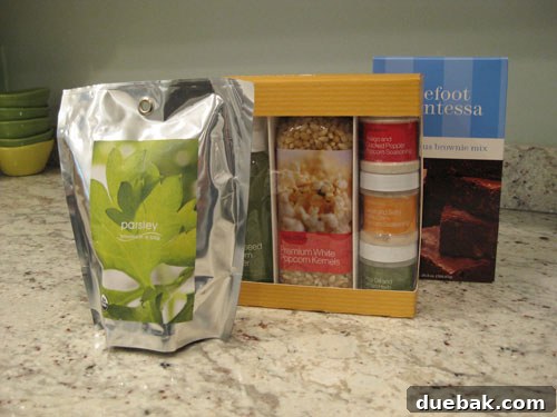 Basket of kitchen goodies featuring organic parsley, gourmet popcorn, and Barefoot Contessa brownie mix