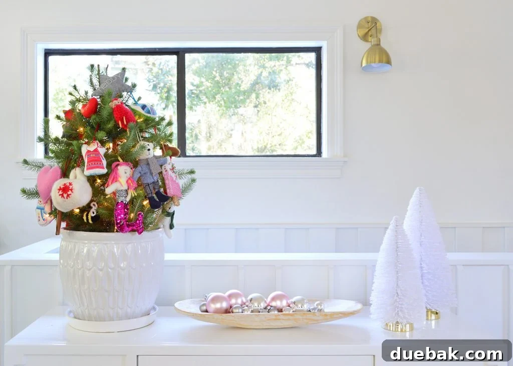 Whit Tabletop With Small Tree Shiny Ornaments And Bottlebrush Trees