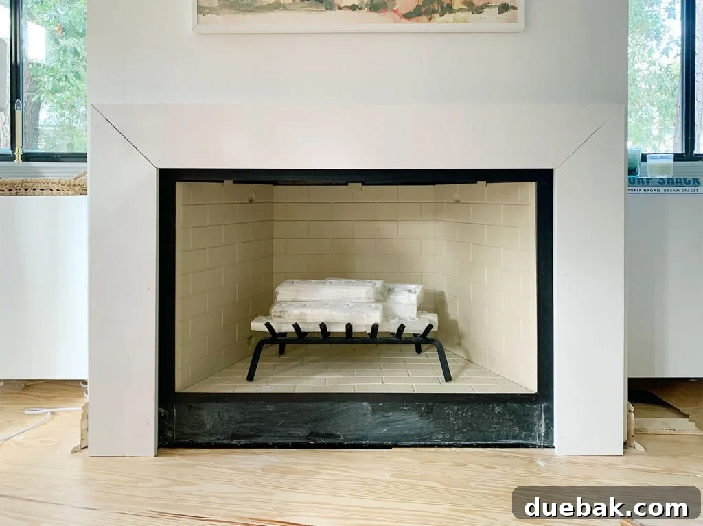 Thick White Board Added To Top Of Fireplace Mantel To Completely Cover Brace