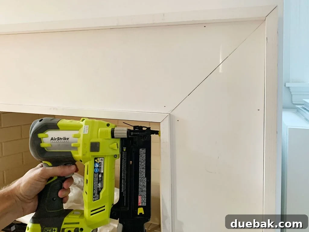 Nail Gun Securing Inner Border Pieces Around Inside Of Mantel