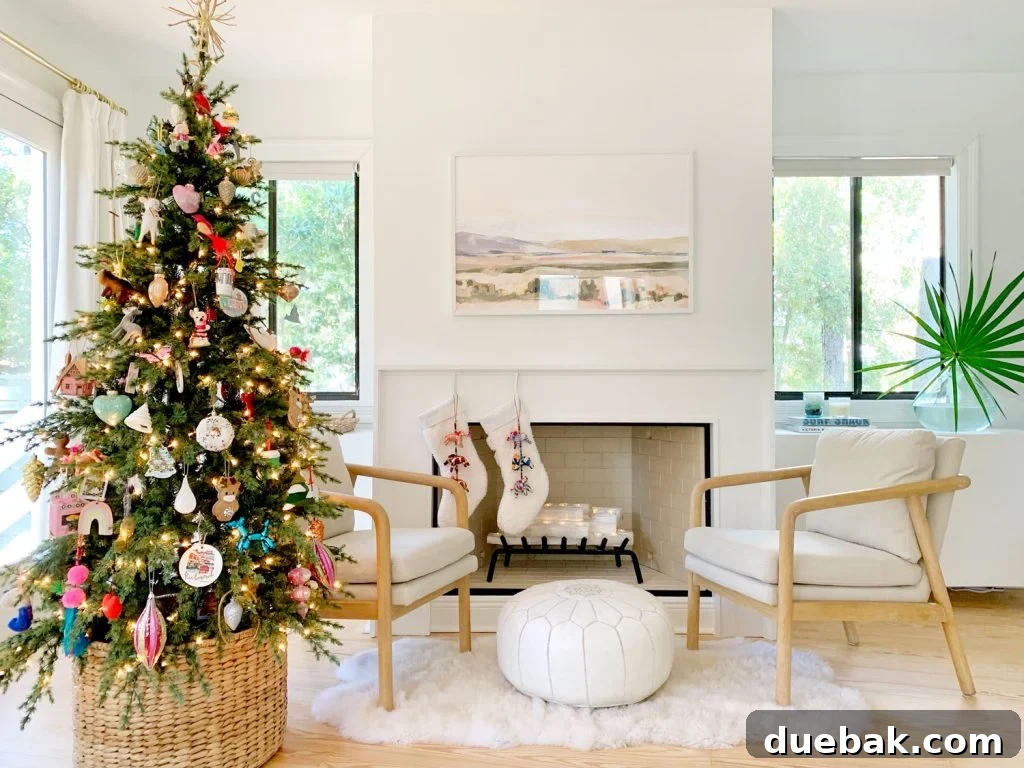 Bedroom fireplace scene with Christmas tree chairs and stockings, after renovation