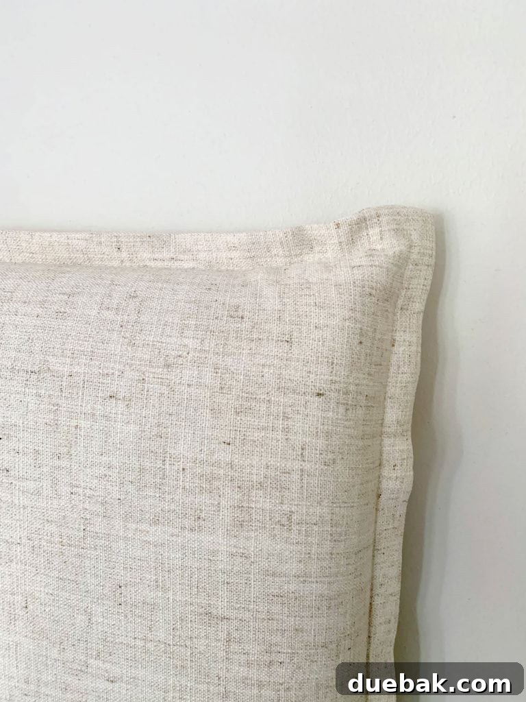 Close up detail of french seam on edge of linen headboard