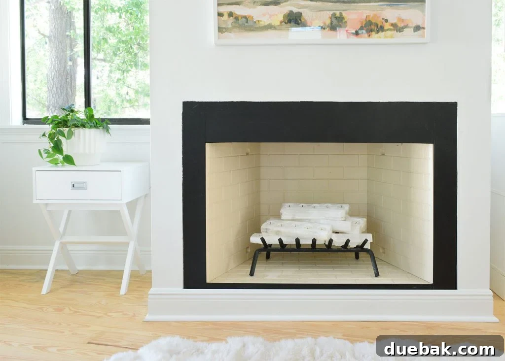 Fireplace with metal cleaned and painted and interior brick painted beige