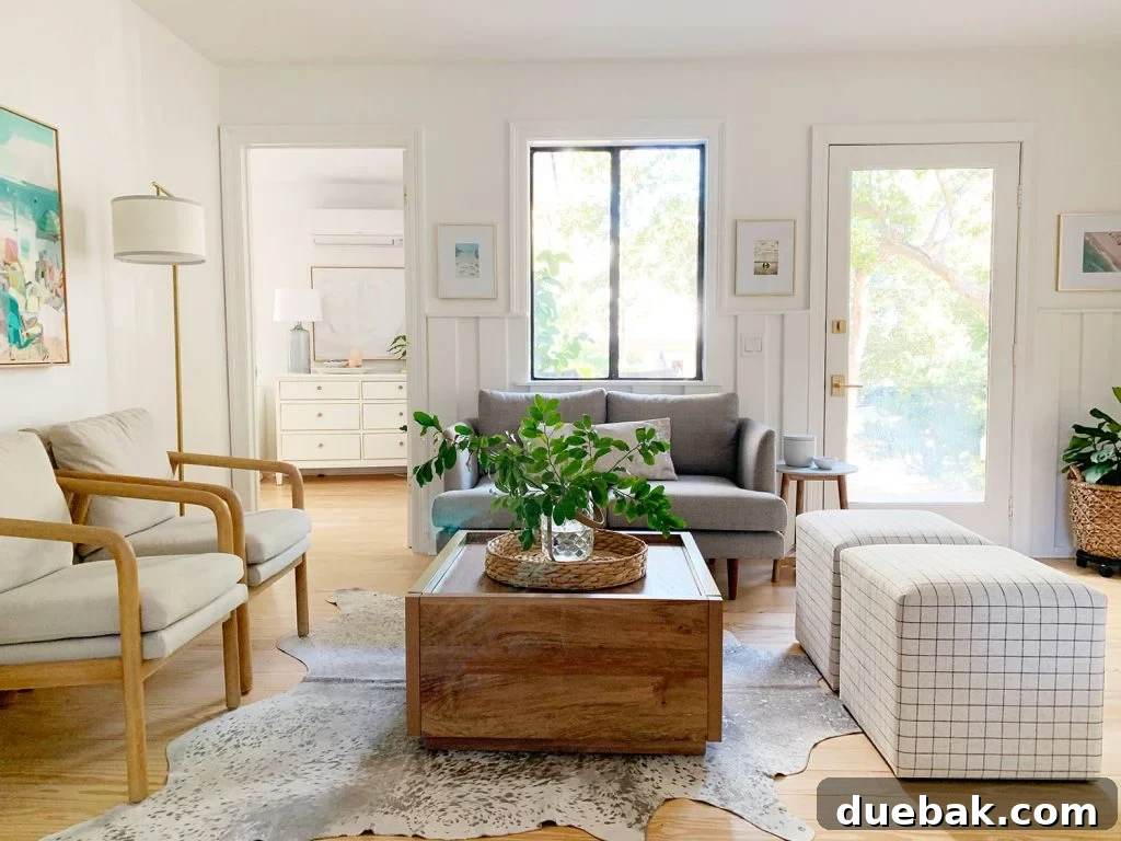 Intimate Comfort: Your Sitting Room Loveseat 2 Sitting area including wood coffee table two plaid ottomans two arm chairs and gray loveseat