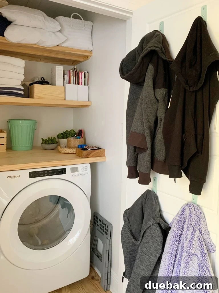 Intimate Comfort: Your Sitting Room Loveseat 13 Coats hung on back of laundry closet door