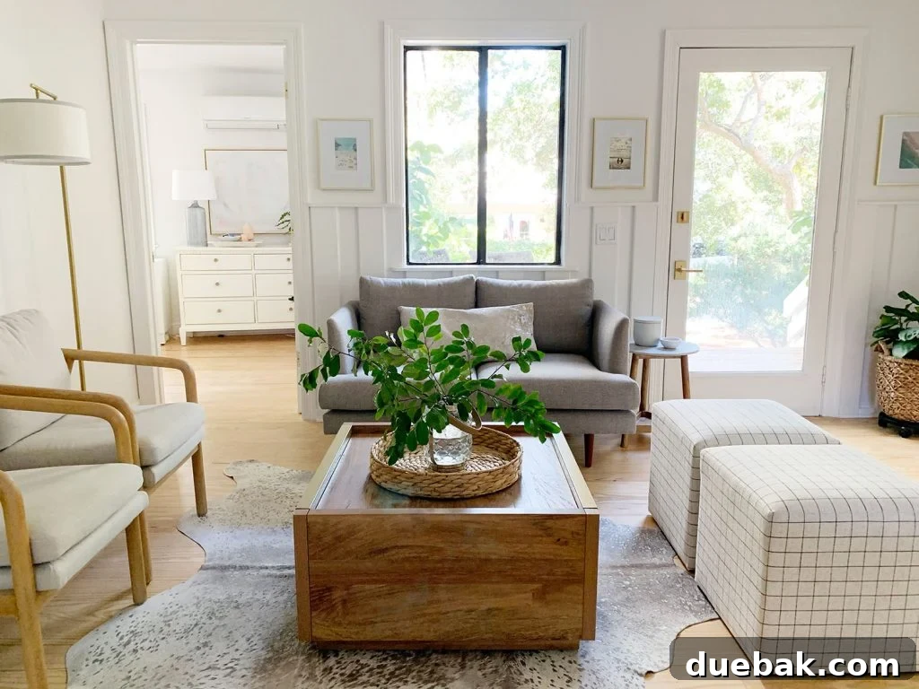Intimate Comfort: Your Sitting Room Loveseat 8 Sitting area including wood coffee table two plaid ottomans two arm chairs and gray loveseat