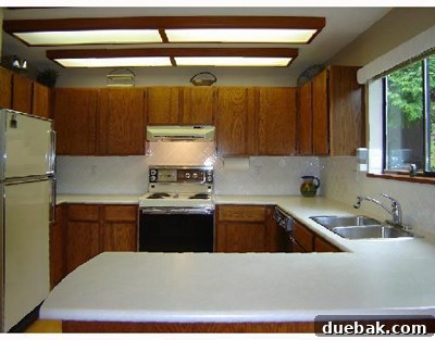 Outdated kitchen with bulky fluorescent light box (Sunshine Ceiling)