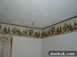 Dated room with cartoon character wallpaper border