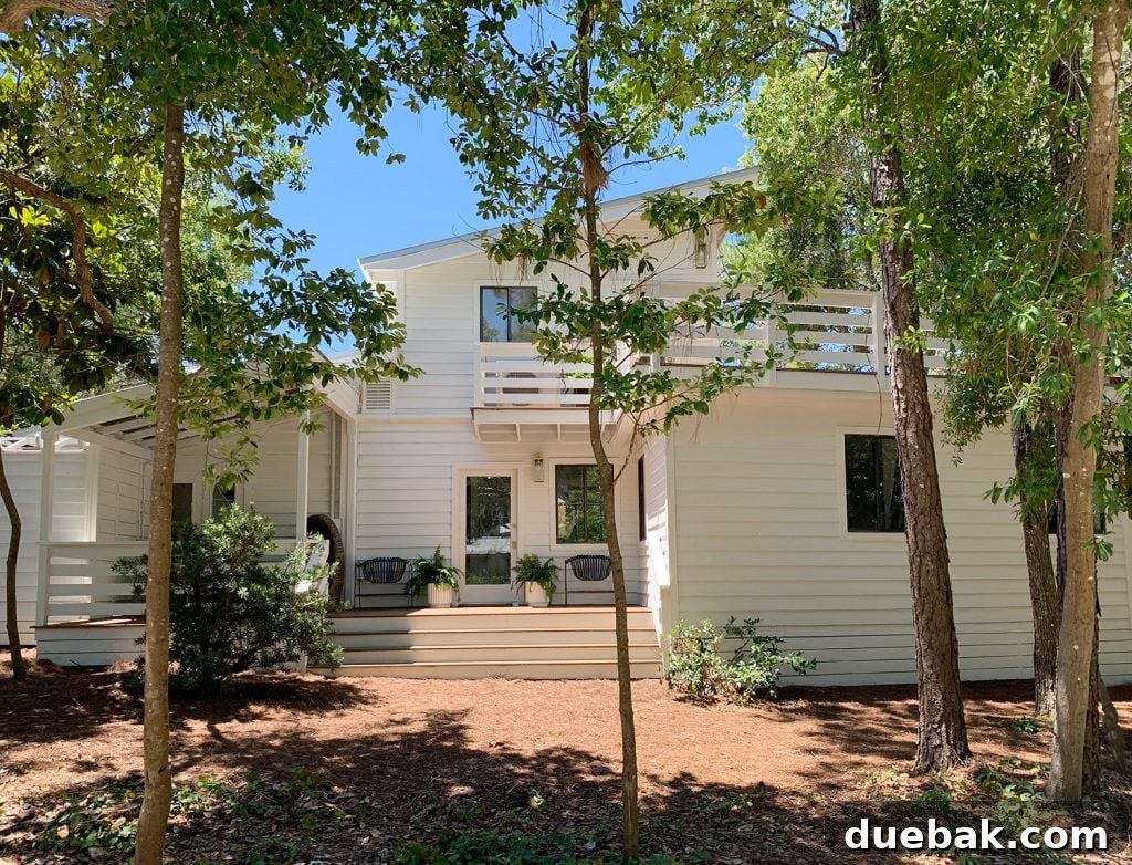 Renovated Florida Home Exterior with White Paint and New Railings