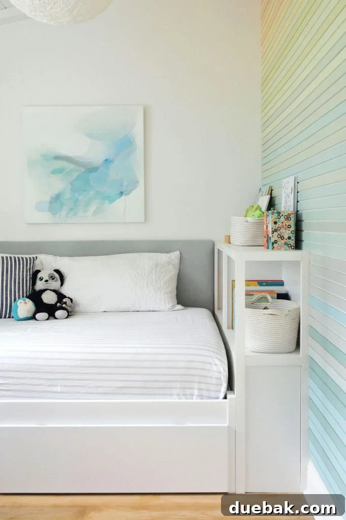 Boys Twin Bed With Fabric Headboard Bookcase And Rainbow Gradient Wall Treatment
