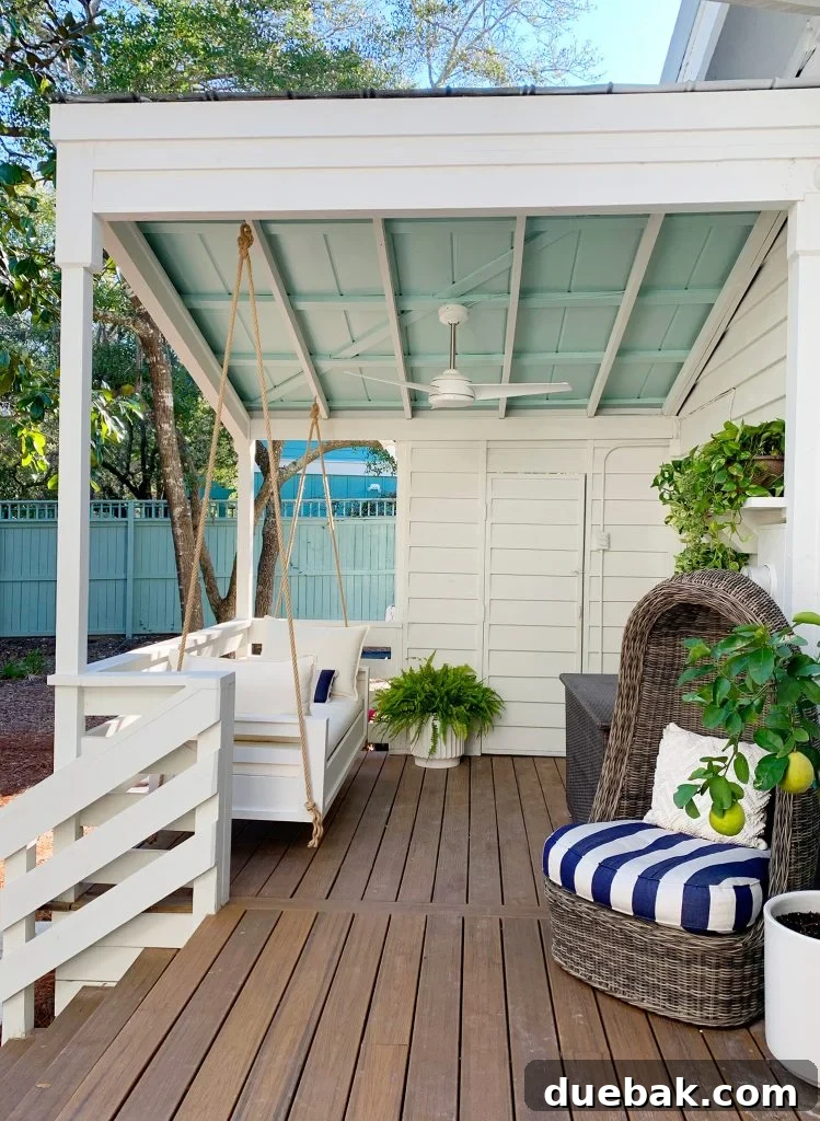 Finished White Hanging Daybed Under Covered Front Porch