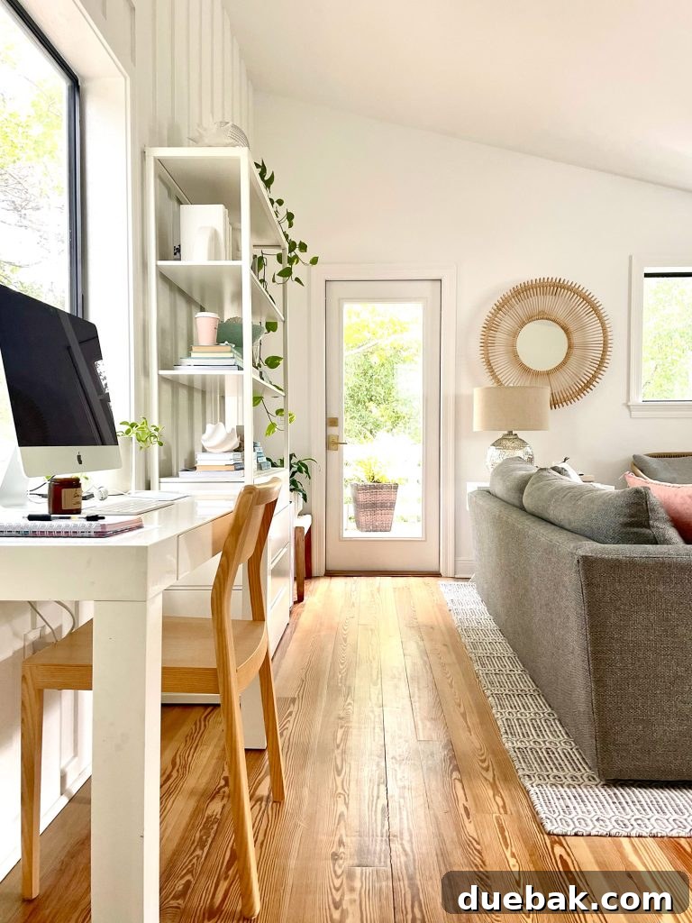 View Toward Door To Deck Off Of Upstairs Family Room With Office Desk In Foreground