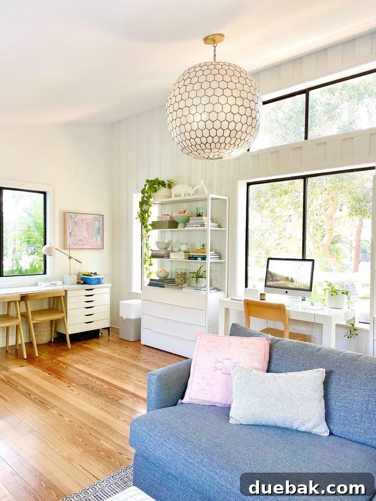 Serena & Lily Capiz Chandelier In Modern Upstairs Family Room With Hardwood Floors