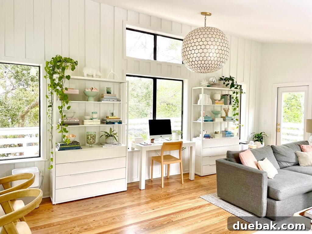 After Photo Of Modern Upstairs Family Room With White Paneled Walls And Capiz Globe Light Fixture