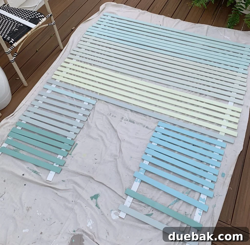 Painted Lattice Strips Laid Out On Deck In Various Blue Green And Gray Colors