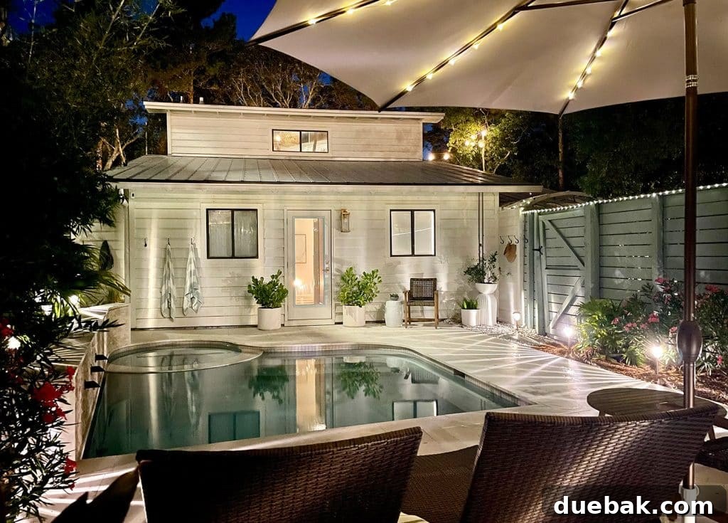 Outdoor Solar Lights: Top Picks for Bright, Long-Lasting Illumination 2 Nighttime View Of Back of House With Pool And Solar LED Lighting