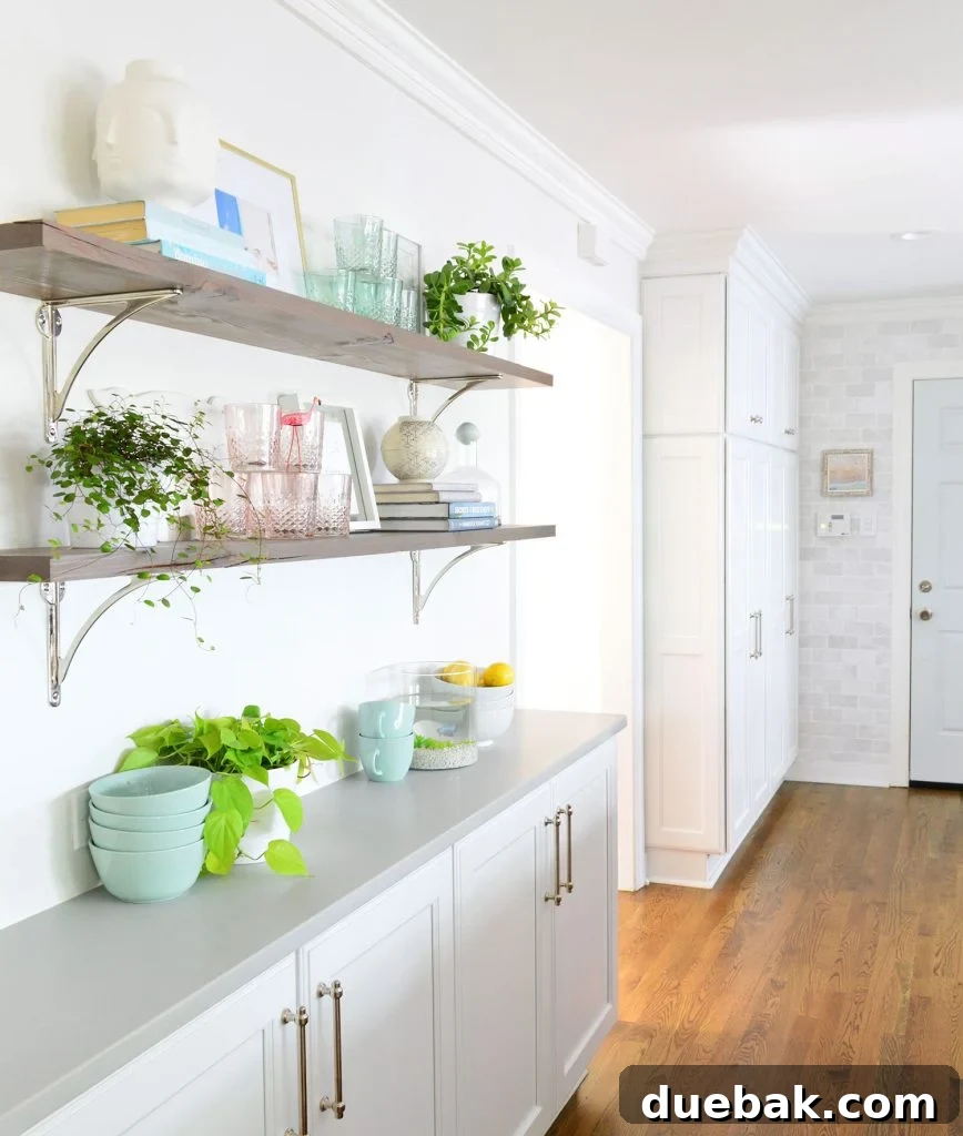 Reclaimed Wood Shelves With Polished Nickel Brackets In White Kitchen