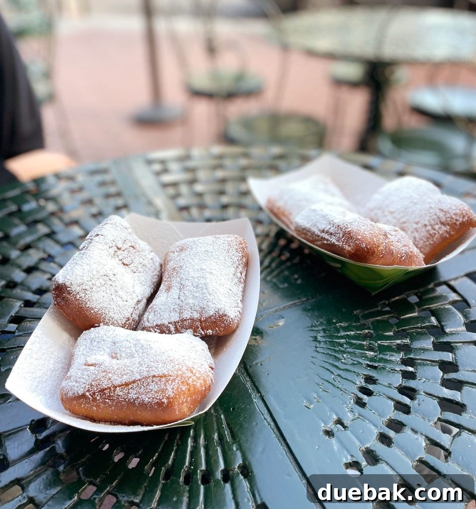 Beignets On Cafe Table In New Orleans