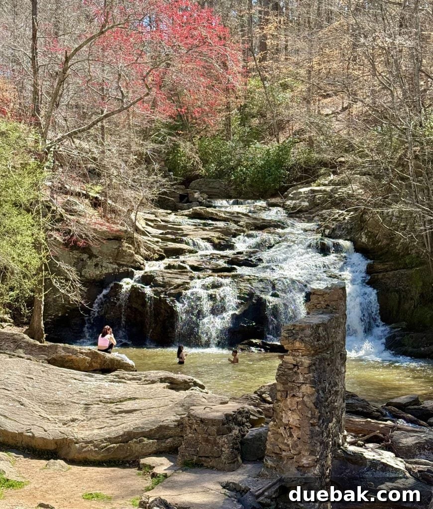 A Weekend Getaway in Serenbe, Georgia: What to See and Do 9 People Playing In Waterfall at Cochran Mills Park Near Serenbe Georgia