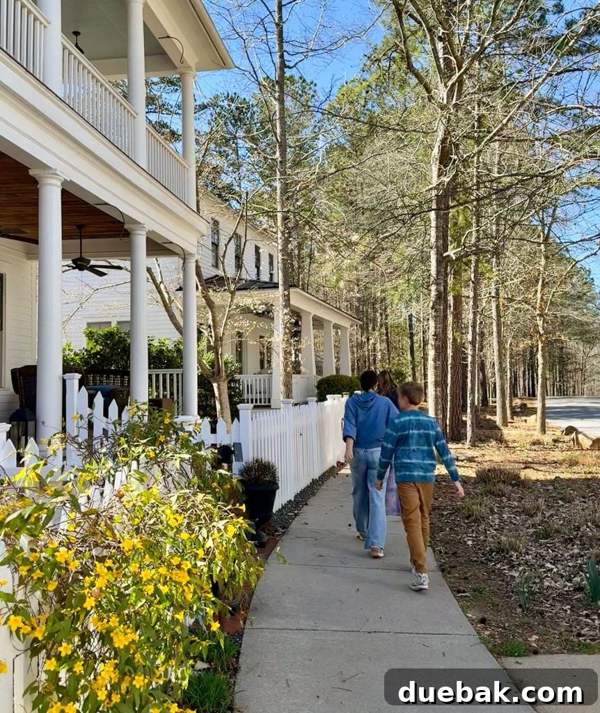 A Weekend Getaway in Serenbe, Georgia: What to See and Do 5 Family Walking Past Homes In Serenbe Georgia