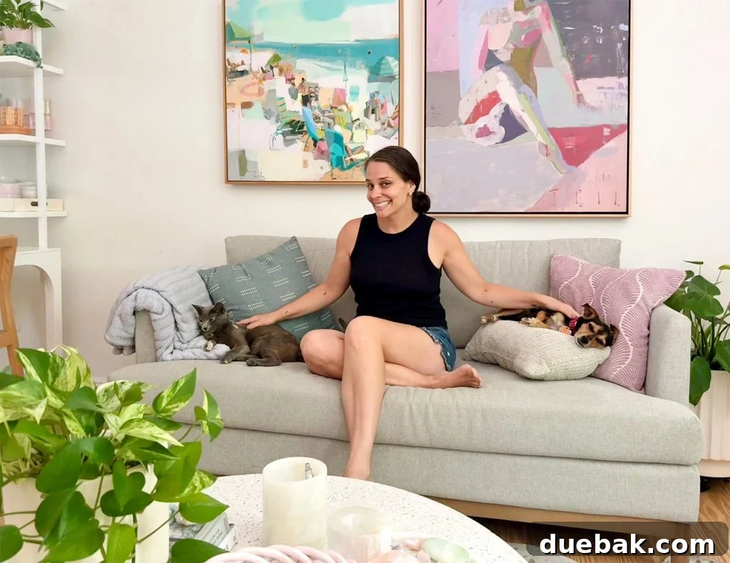 How I Reduced My Cat Allergies: Proven Strategies That Worked 12 Sherry Sitting On Couch With Cat and Dog On Either Side