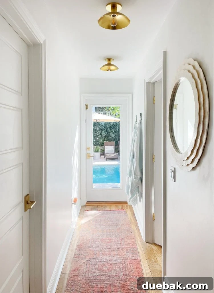 Hallway With Traditional Rug Leading To Pool
