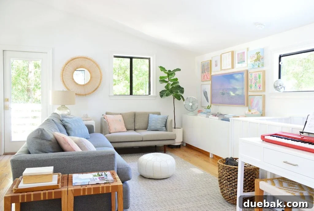 Mid-Renovation Home Update and Video Tour 14 Bright Family Room With Frame TV Collage Hung On Wall