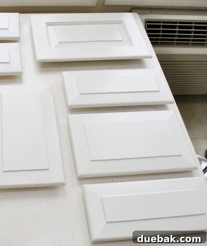 White Painted Kitchen Cabinet Doors Laid Out
