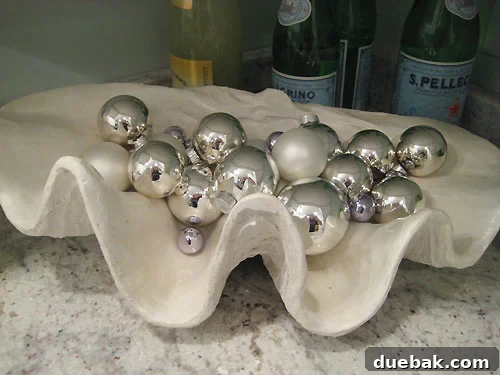 Clam shell ornament bowl Clam shell bowl filled with silver ornaments