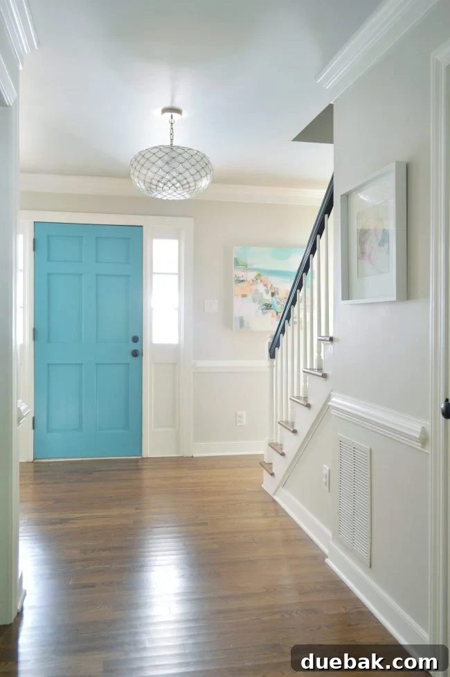 Foyer Makeover: Stylish Lighting and Furniture Updates 11 neutral foyer edgecomb gray with blue front door