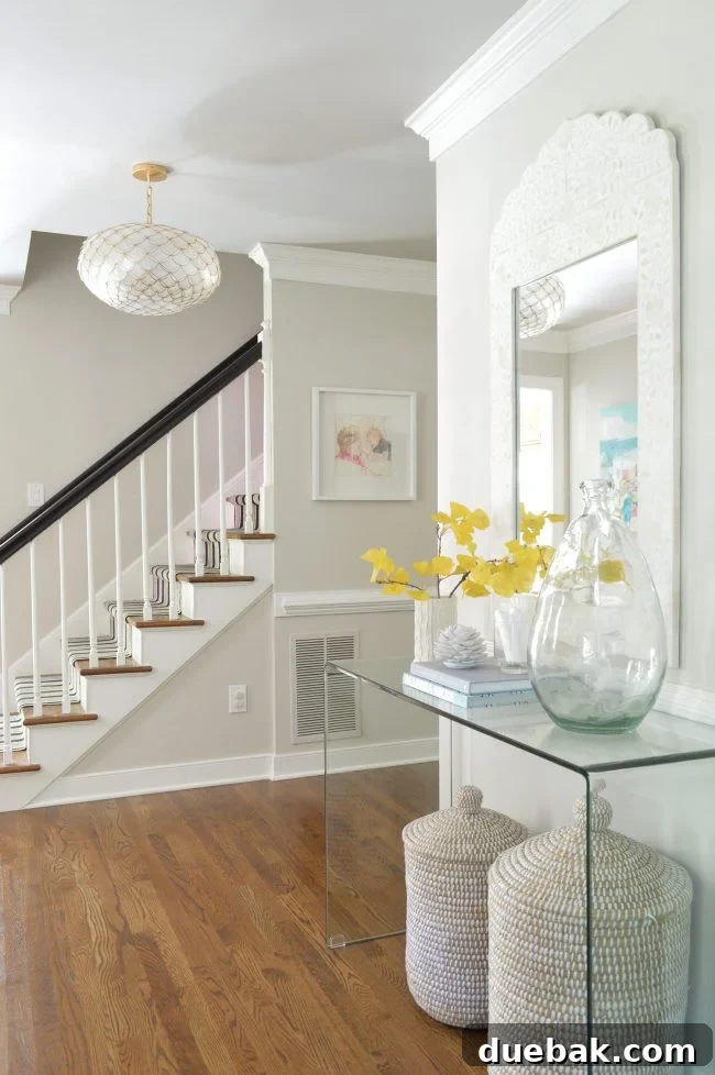Foyer Makeover: Stylish Lighting and Furniture Updates 4 neutral foyer beachy capiz light gingko leaf