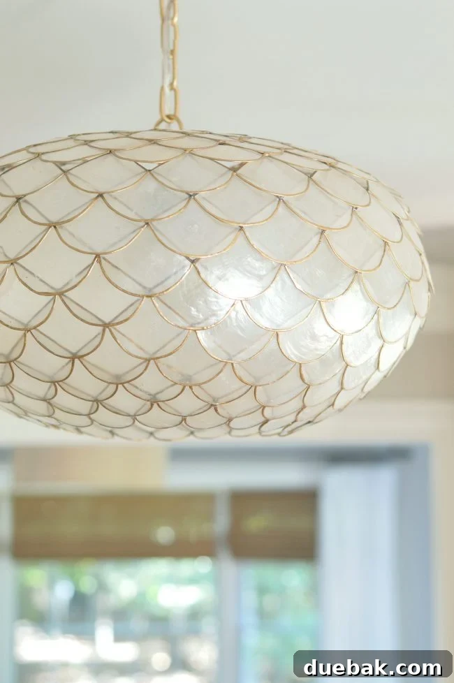 Foyer Makeover: Stylish Lighting and Furniture Updates 5 serena and lily gold capiz chandelier