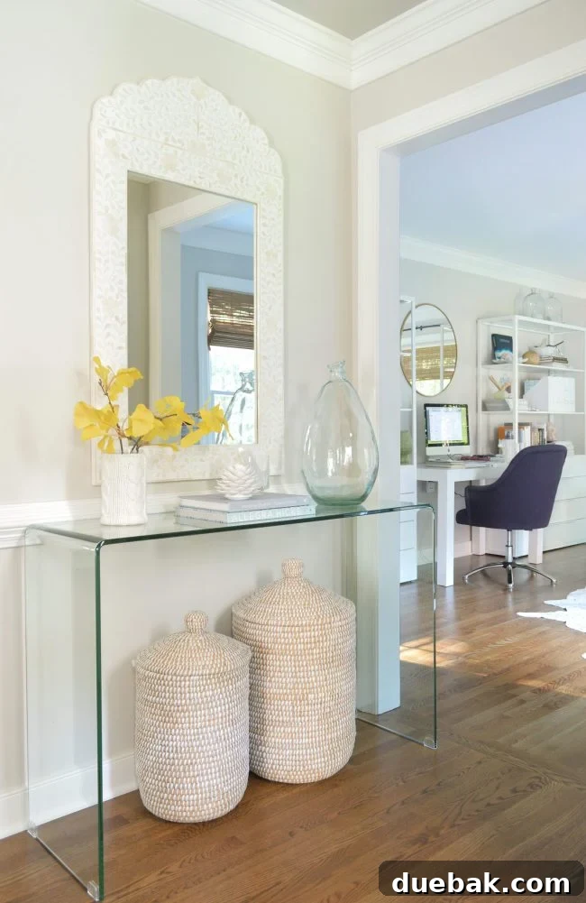 Foyer Makeover: Stylish Lighting and Furniture Updates 6 neutral foyer gingko leaf basket mirror