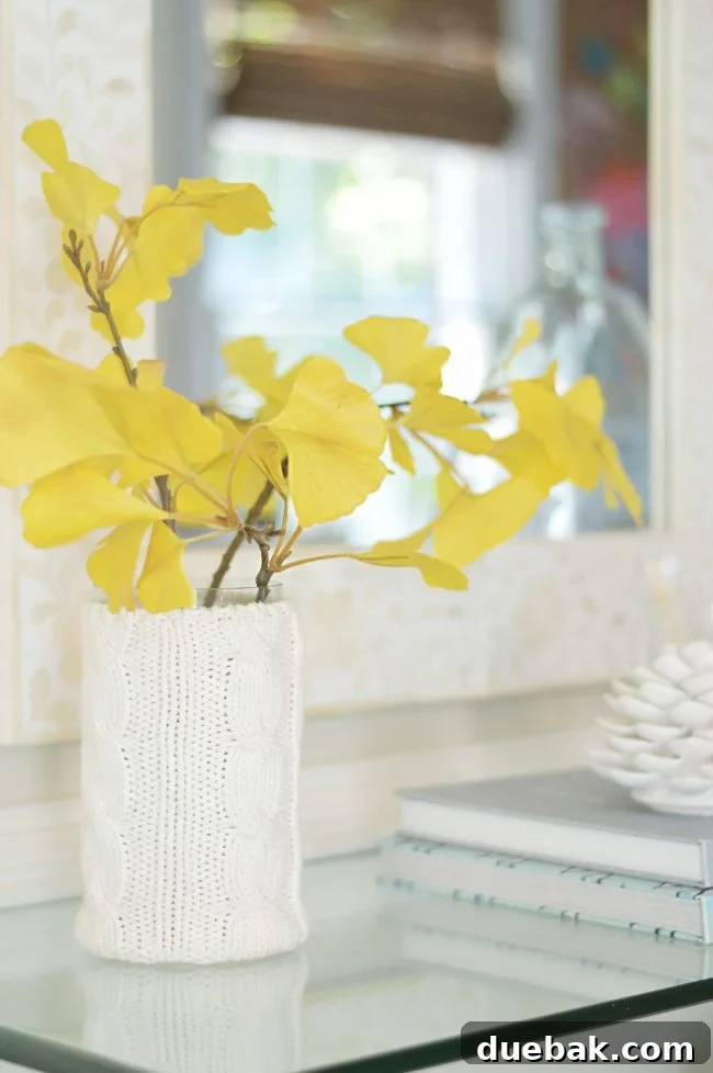 Foyer Makeover: Stylish Lighting and Furniture Updates 8 faux gingko leaf branch decor in vase