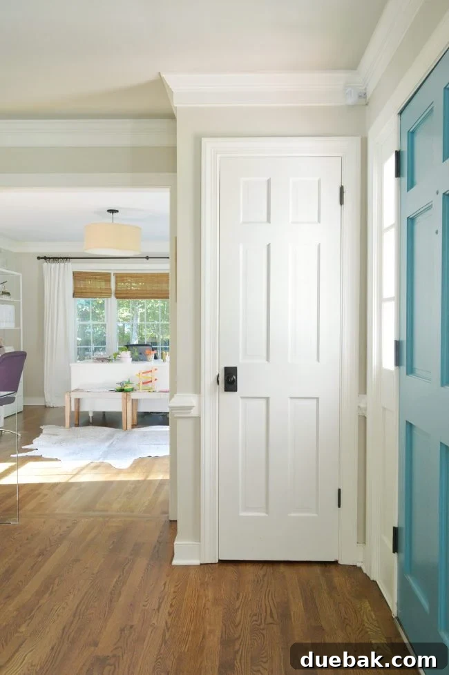 Foyer Makeover: Stylish Lighting and Furniture Updates 9 neutral foyer game closet door closed