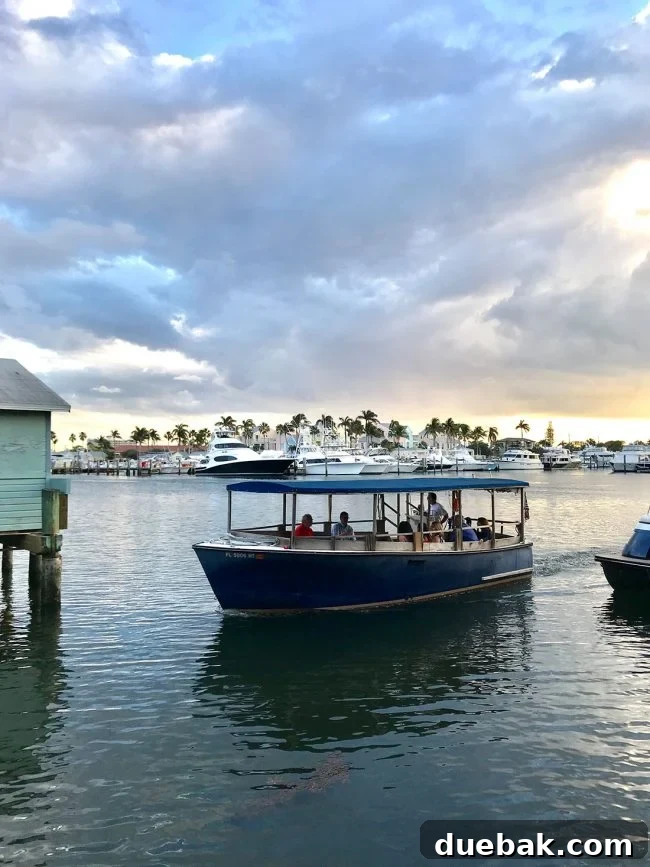 small boat picking up diners for Cap's Place Restaurant in Lighthouse Point Florida