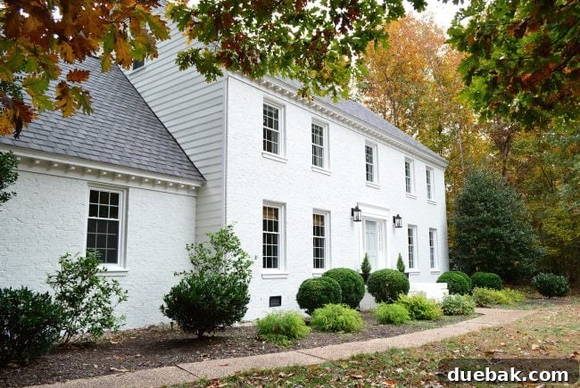 How We Transformed Our Brick House with White Paint 3 moderne white painted brick house with blue door
