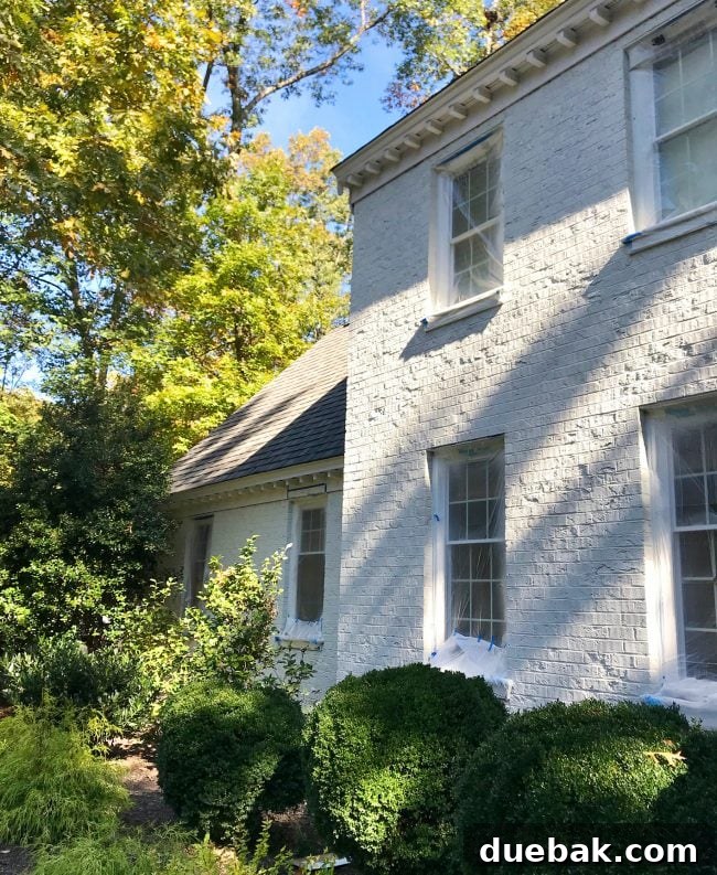 How We Transformed Our Brick House with White Paint 15 after photo of brick house painted sherwin williams moderne white