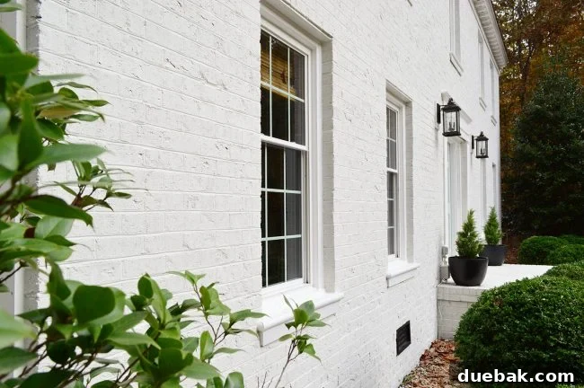 How We Transformed Our Brick House with White Paint 22 Close Up Photo Of White Painted Brick Home From Side