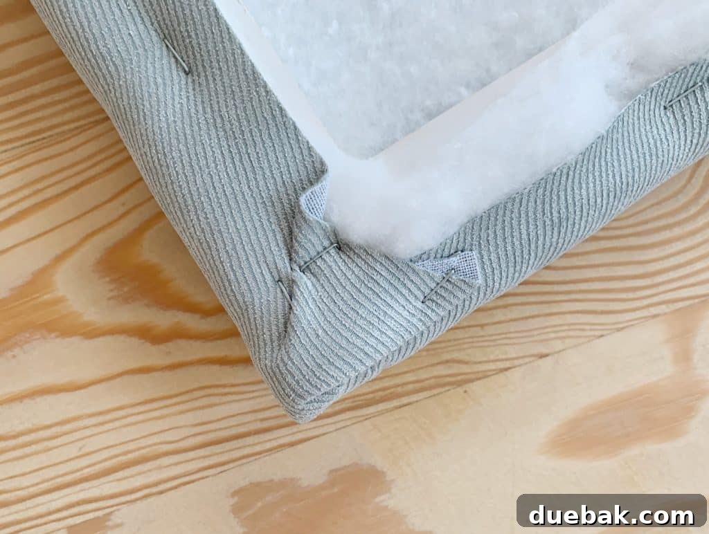 DIY Headboard Ideas: Simple Projects for a Stylish Bedroom 12 Detail of fabric stapled around corner of DIY headboard for boys bedroom