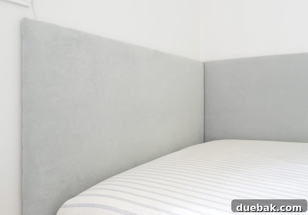 DIY Headboard Ideas: Simple Projects for a Stylish Bedroom 15 Close up of finished DIY headboard on two sides of built-in daybed in boys bedroom