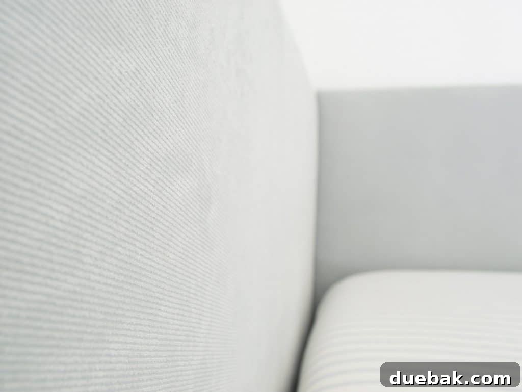 DIY Headboard Ideas: Simple Projects for a Stylish Bedroom 16 Fabric detail on DIY upholstered headboard with subtle blue ribbing