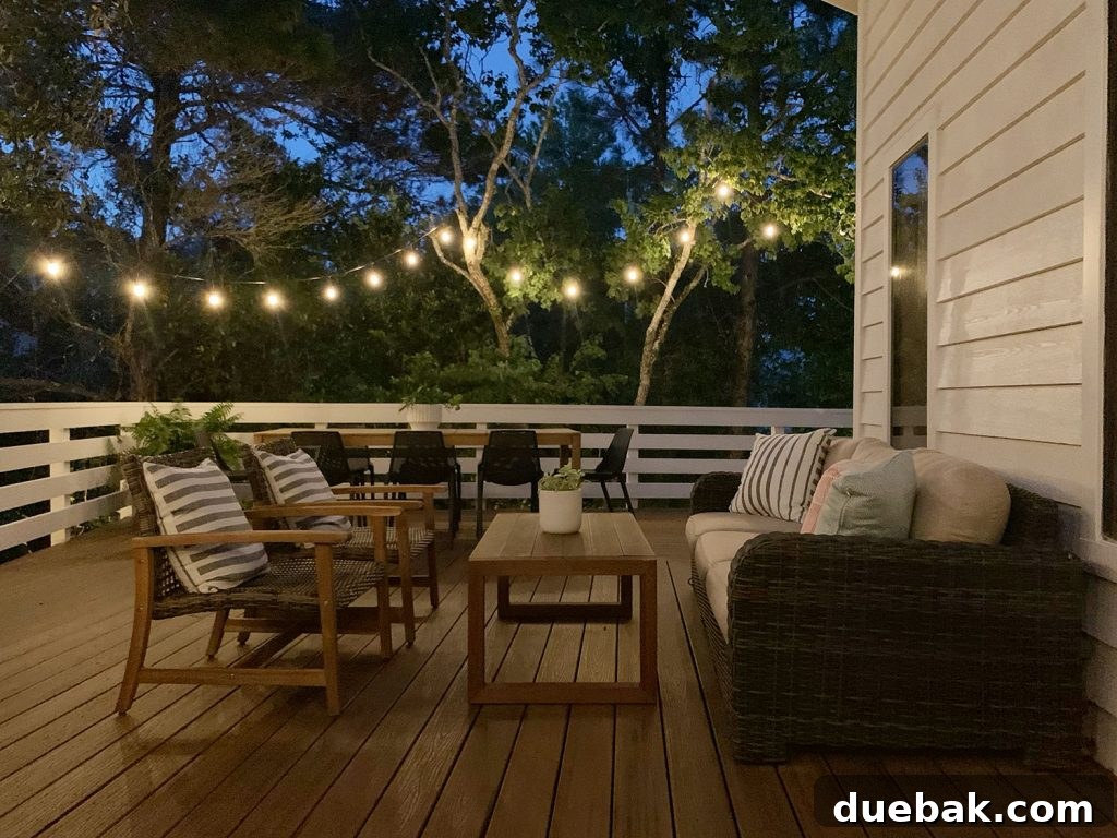 Nighttime View Of Outdoor Deck Seating Area With String Lights