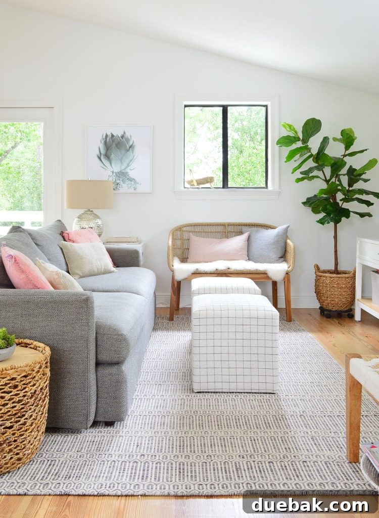Family Room With Couch Striped Ottomans And Woven Bench