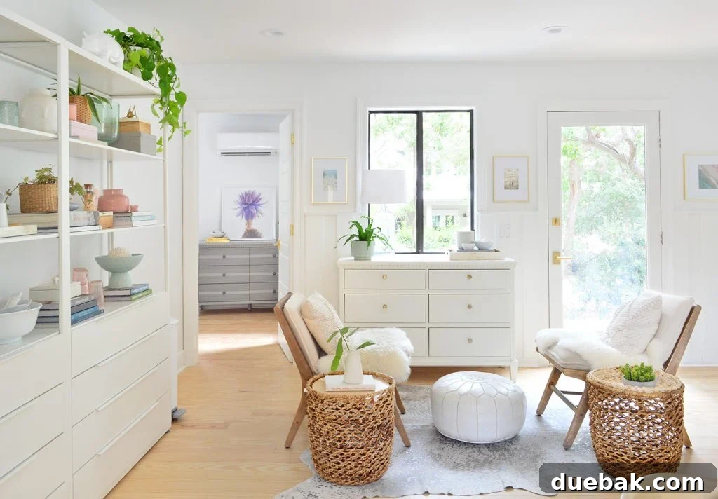 Seating area in white kitchen with chairs and opens shelving