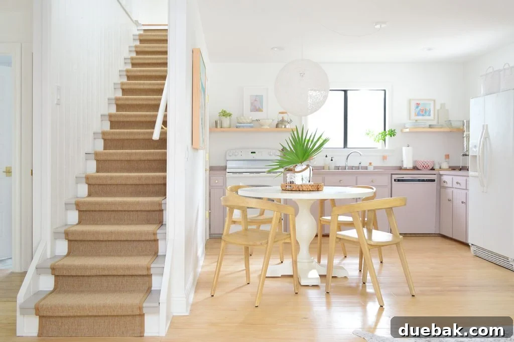 Kitchen With Mauve Cabinets And Stairs With Sisal Runner