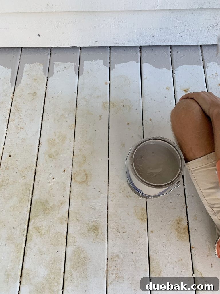 How to Paint a Porch Floor: Step-by-Step Guide for Lasting Results 4 White painted porch floor stained with leaf marks