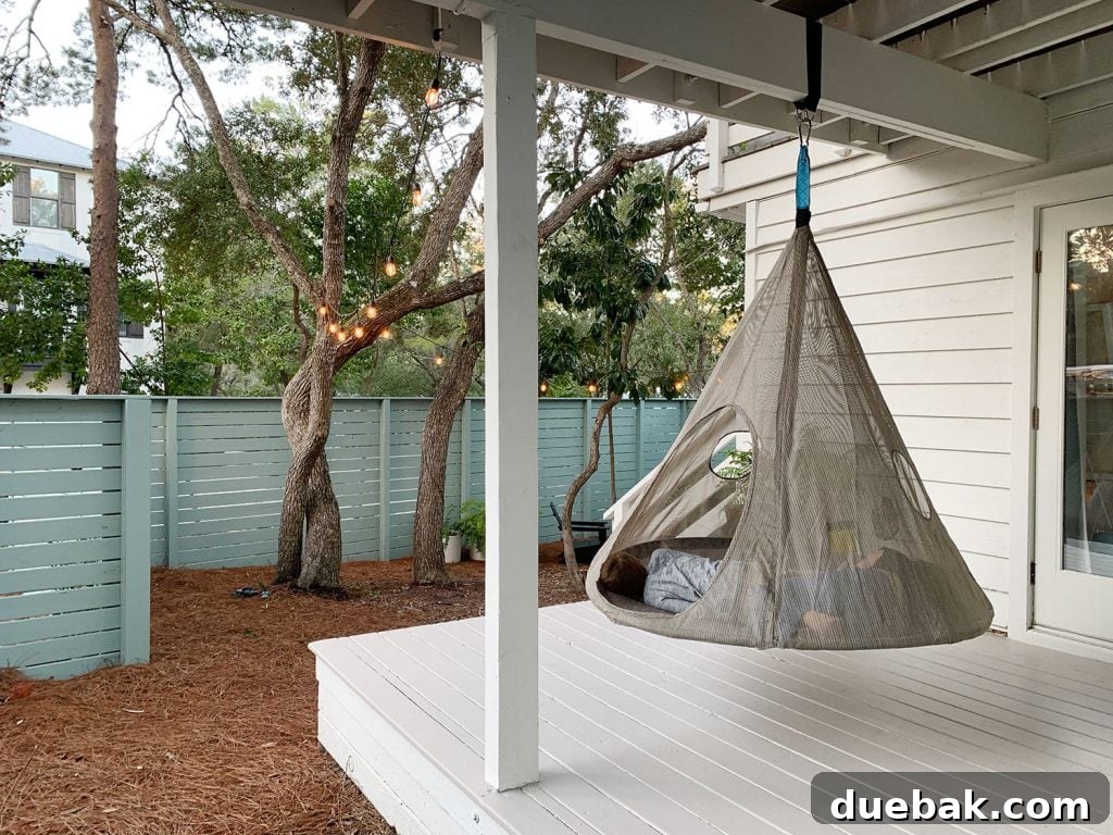 How to Paint a Porch Floor: Step-by-Step Guide for Lasting Results 9 Two kids laying in hanging tent on covered porch