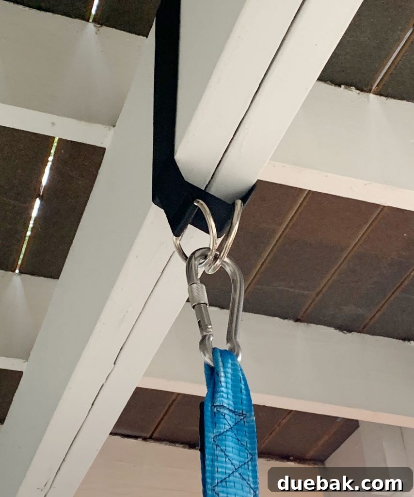How to Paint a Porch Floor: Step-by-Step Guide for Lasting Results 10 Close up of nylon strap wrapped over porch beach with tent hooked to d rings