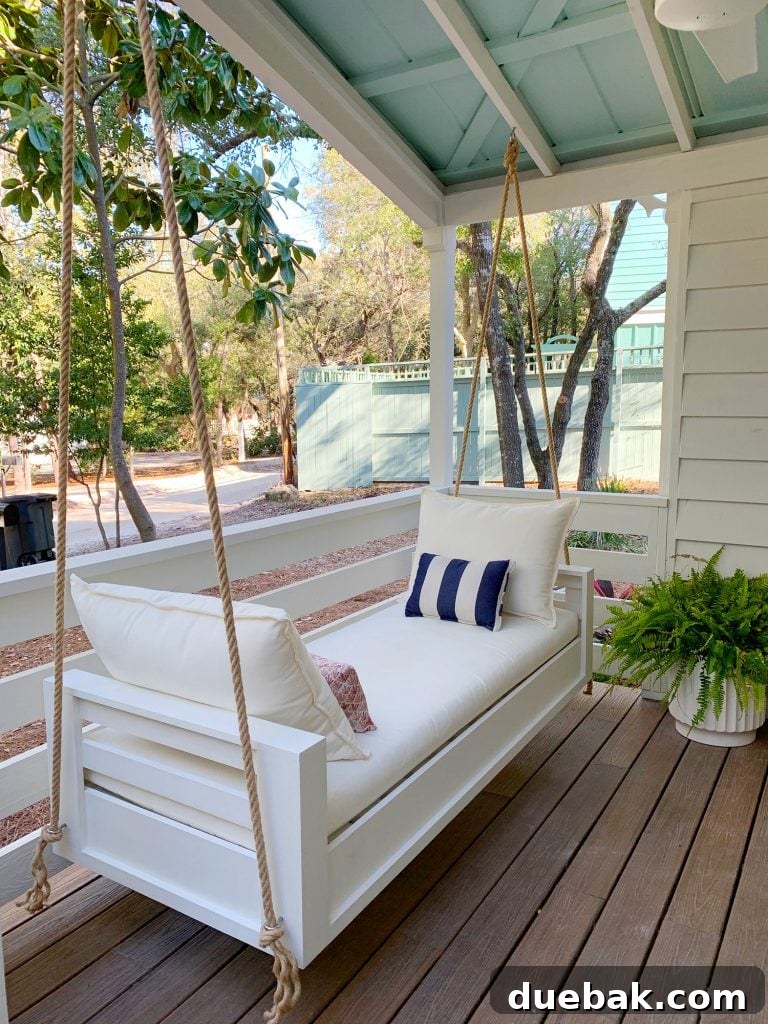 Angled View Of Finished Outdoor Hanging Daybed With White Cushions